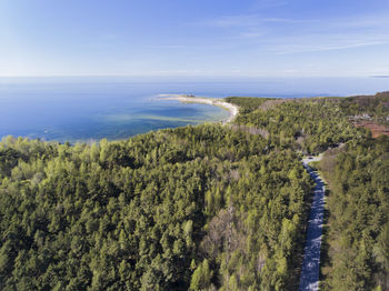 High angle view of trees by sea against sky