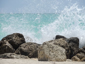 Waves splashing on rocks at shore