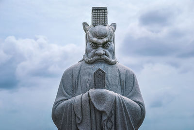 Low angle view of statue against sky