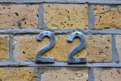 House number 22 on a brick wall in london