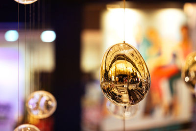 Close-up of illuminated light bulbs in restaurant