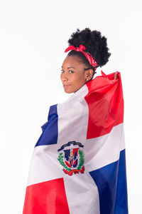 Woman holding flag against white background