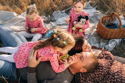 Quality family time, triple the fun with triplets on a nature picnic on a warm autumn day