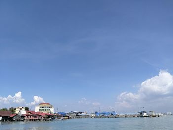 Scenic view of sea against blue sky