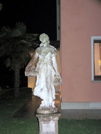 Statue against white building