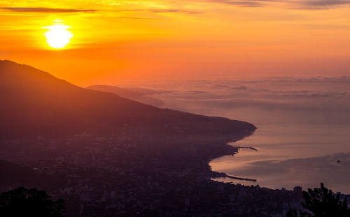 Sunset landscape with sea and mountain