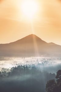 Scenic view of mountains against sky during sunset