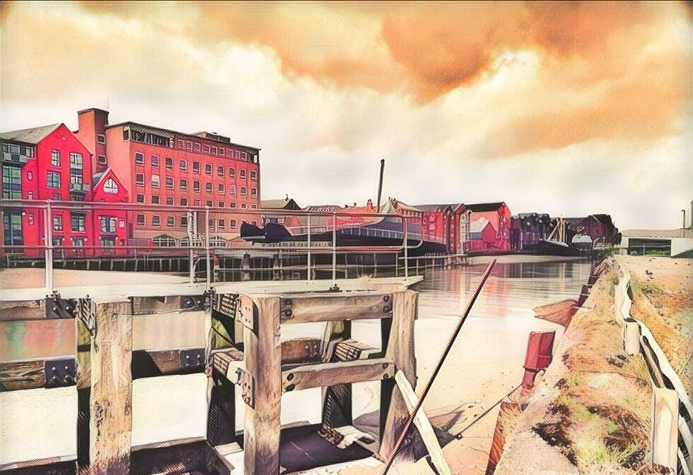 VIEW OF BUILDINGS AGAINST CLOUDY SKY