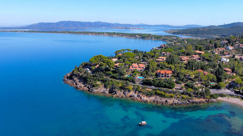 Aerial view of the argentario coast, in the background the orbetello lagoon.