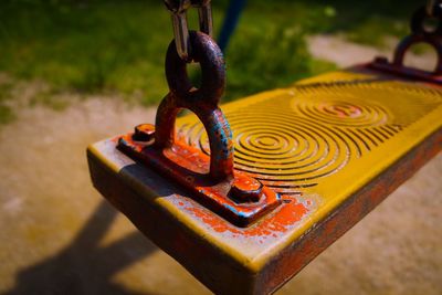 Close-up of chain swing in park