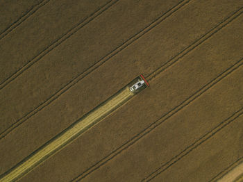 Aerial view of machinery working in agricultural field