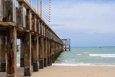 Pier over sea against sky