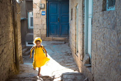 Rear view of woman walking on street