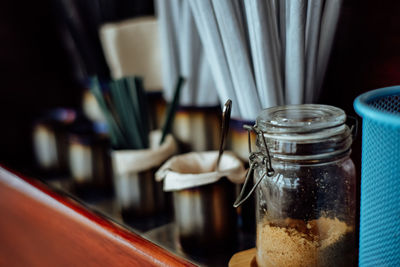 Close-up of coffee in glass jar on table