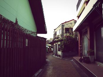 Narrow street along buildings