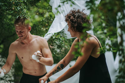 Young couple standing outdoors