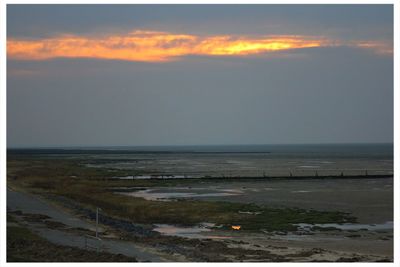 Scenic view of sea at sunset