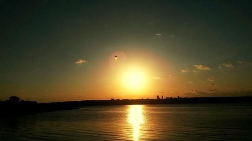 Scenic view of calm sea at sunset