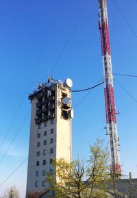 Low angle view of cables against clear blue sky