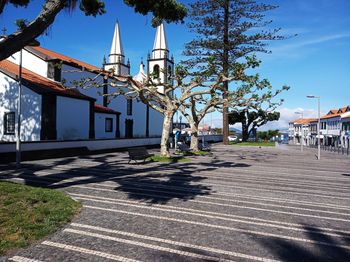 Street amidst buildings against sky