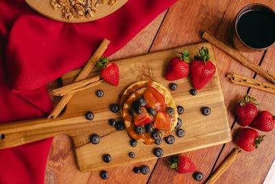 High angle view of strawberries on table