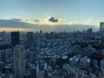 High angle view of modern buildings in city against sky