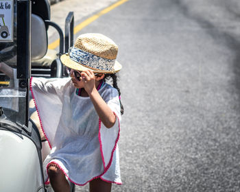 High angle view of girl climbing on buggy