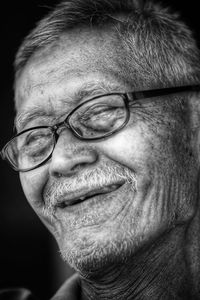 Close-up portrait of man wearing eyeglasses