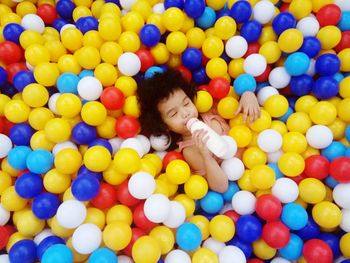 High angle view of woman playing with ball