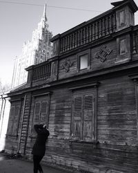 Low angle view of woman standing in building