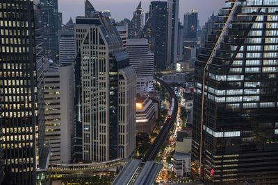 High angle view of illuminated buildings in city