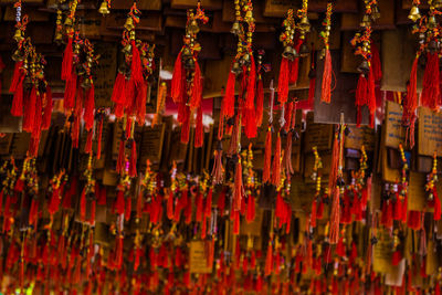 Full frame shot of red lanterns hanging in temple