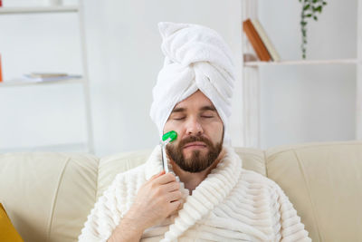 Portrait of young man relaxing at home