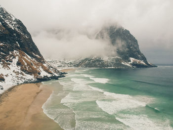 Scenic view of sea against sky during winter