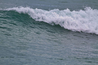 High angle view of waves breaking on sea