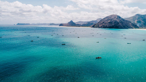 Scenic view of sea against cloudy sky