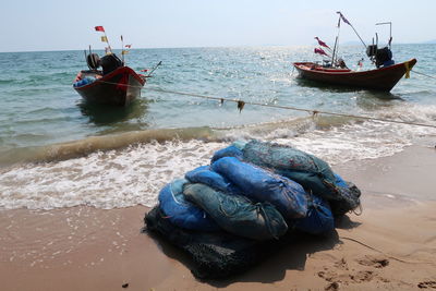 Boat moored on shore