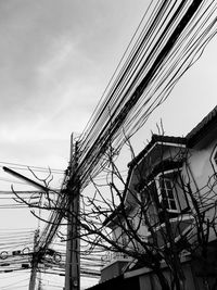 Low angle view of cables against sky