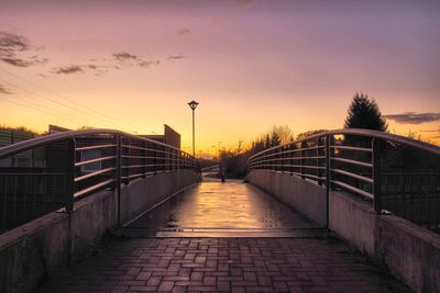 Bridge in city against sky