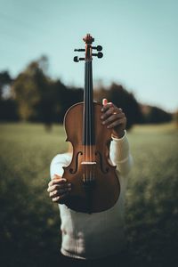 Close-up of hand playing guitar