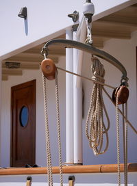 Low angle view of electric lamp hanging on ceiling