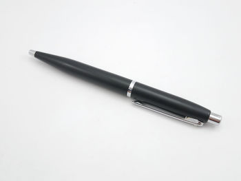 High angle view of pen on table against white background