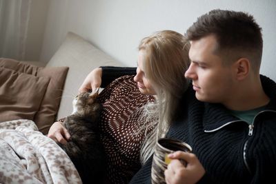 Young couple kissing at home