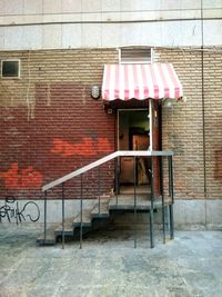 Deck chairs against brick wall