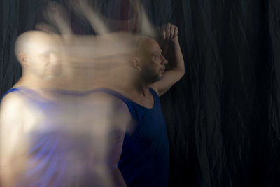 Time lapse view of woman moving a rag. long exposure, motion blur. 