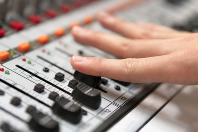 Close-up of hand using sound recorder