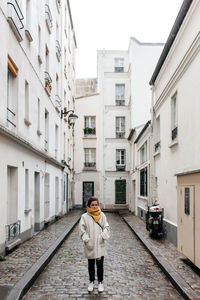 Woman standing in front of building