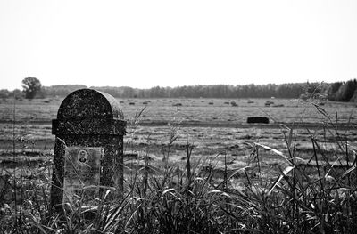 Old ruin on field against clear sky