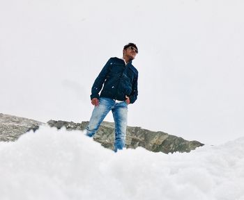 Full length of man standing on snow