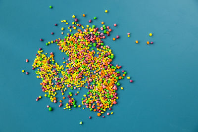 Candy on the blue table, colorful sweet candy background, high angle view